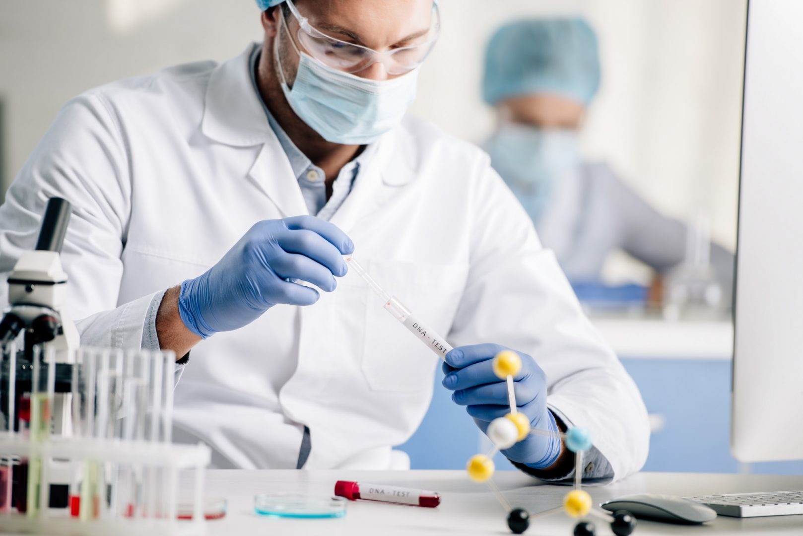 selective focus of genetic consultant doing dna test in lab